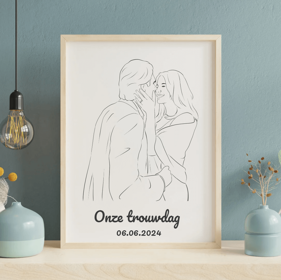 Tekening verliefd stel met tekst "Onze trouwdag" en datum 06.06.2024, ingelijst op tafel.