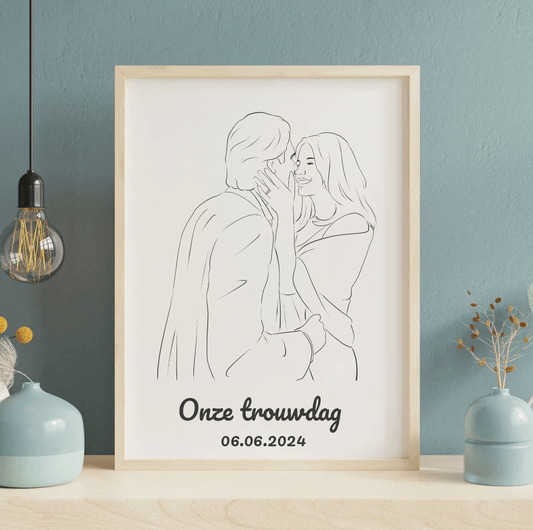 Tekening verliefd stel met tekst "Onze trouwdag" en datum 06.06.2024, ingelijst op tafel.